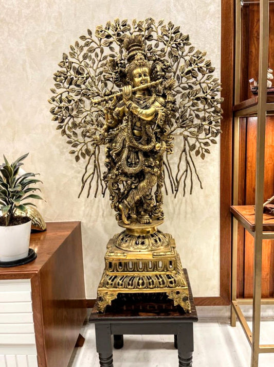 Krishna idol with tree