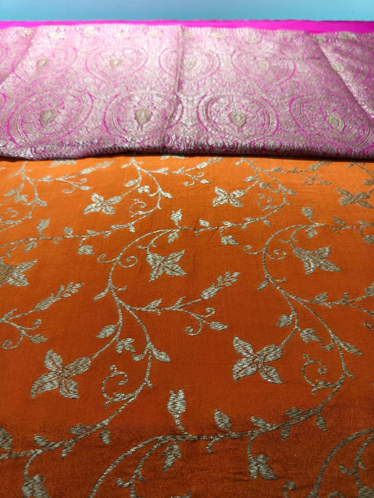 Pure crepe orange silk saree in sheer and breathable silk completely hand woven with pure zari