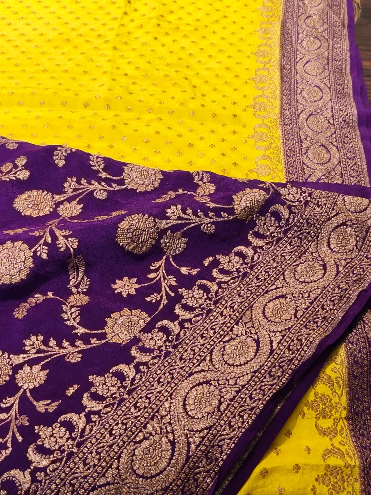 Pure crepe yellow with contrast wine colour silk saree in sheer, and breathable fabric traditionally woven from 100% mulberry silk and pure zari, completely hand weaved