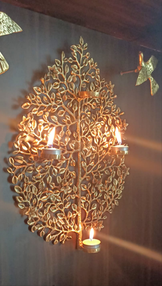 Decorative tree wall hanging with candle holders..