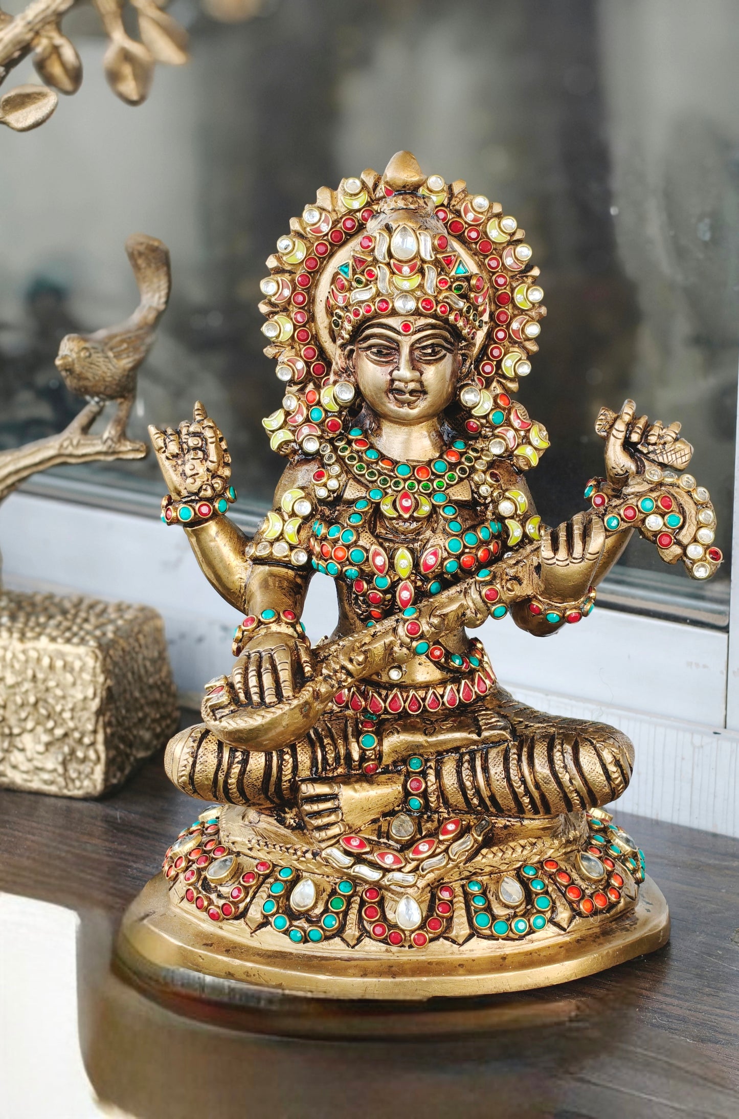 Godess saraswati idol in brass with special stonework done by hand