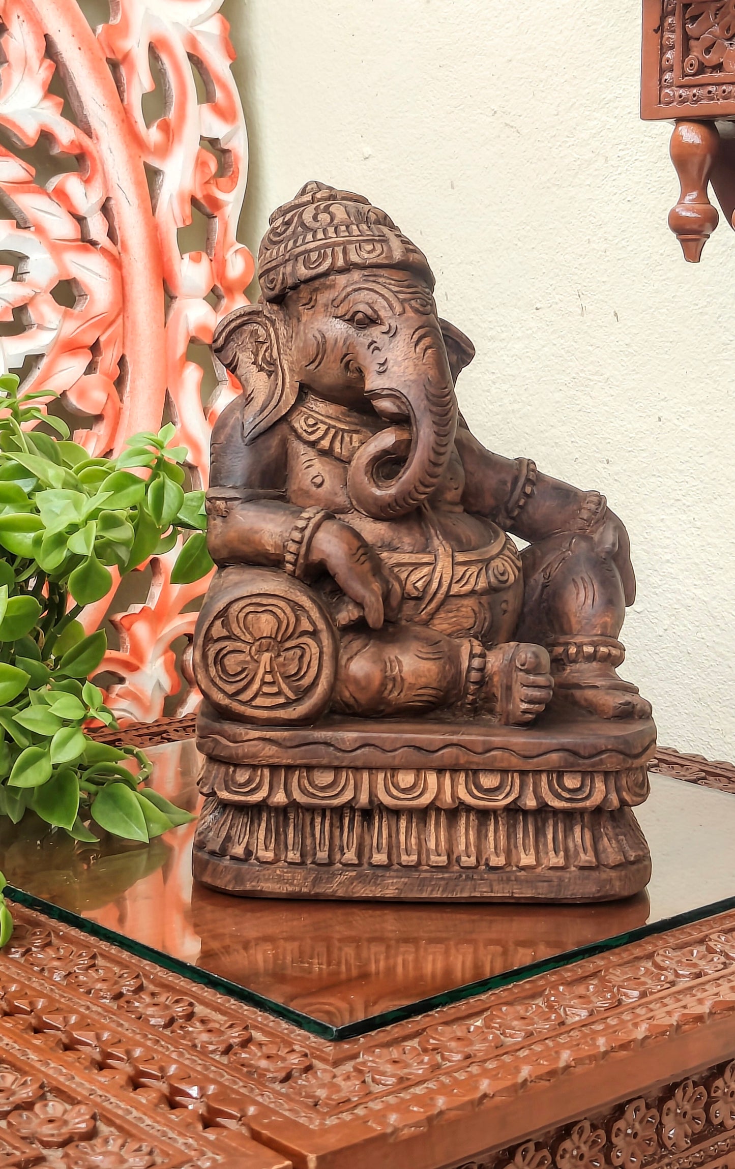 Ganesha playing musical instrument.