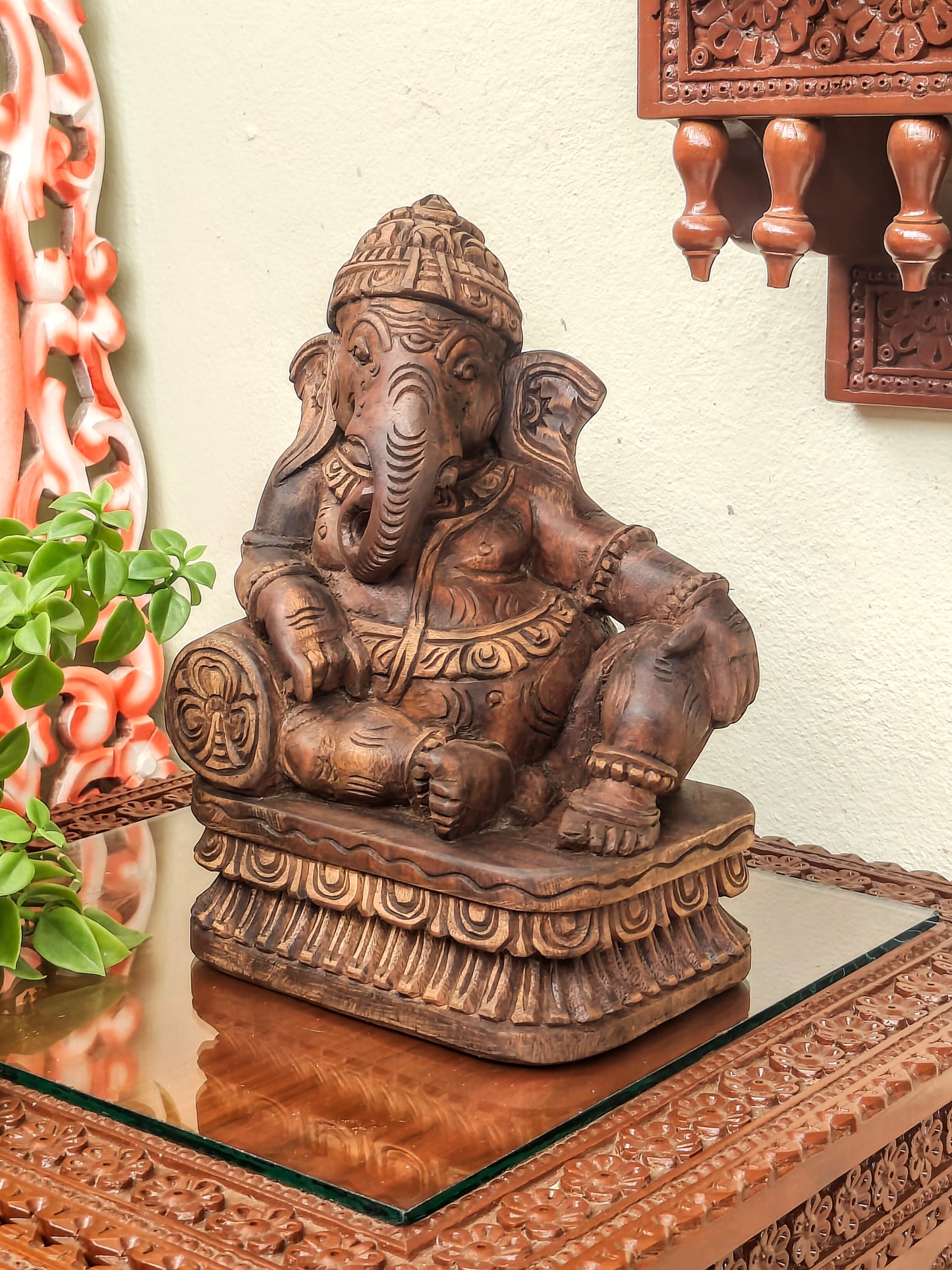 Ganesha playing musical instrument.