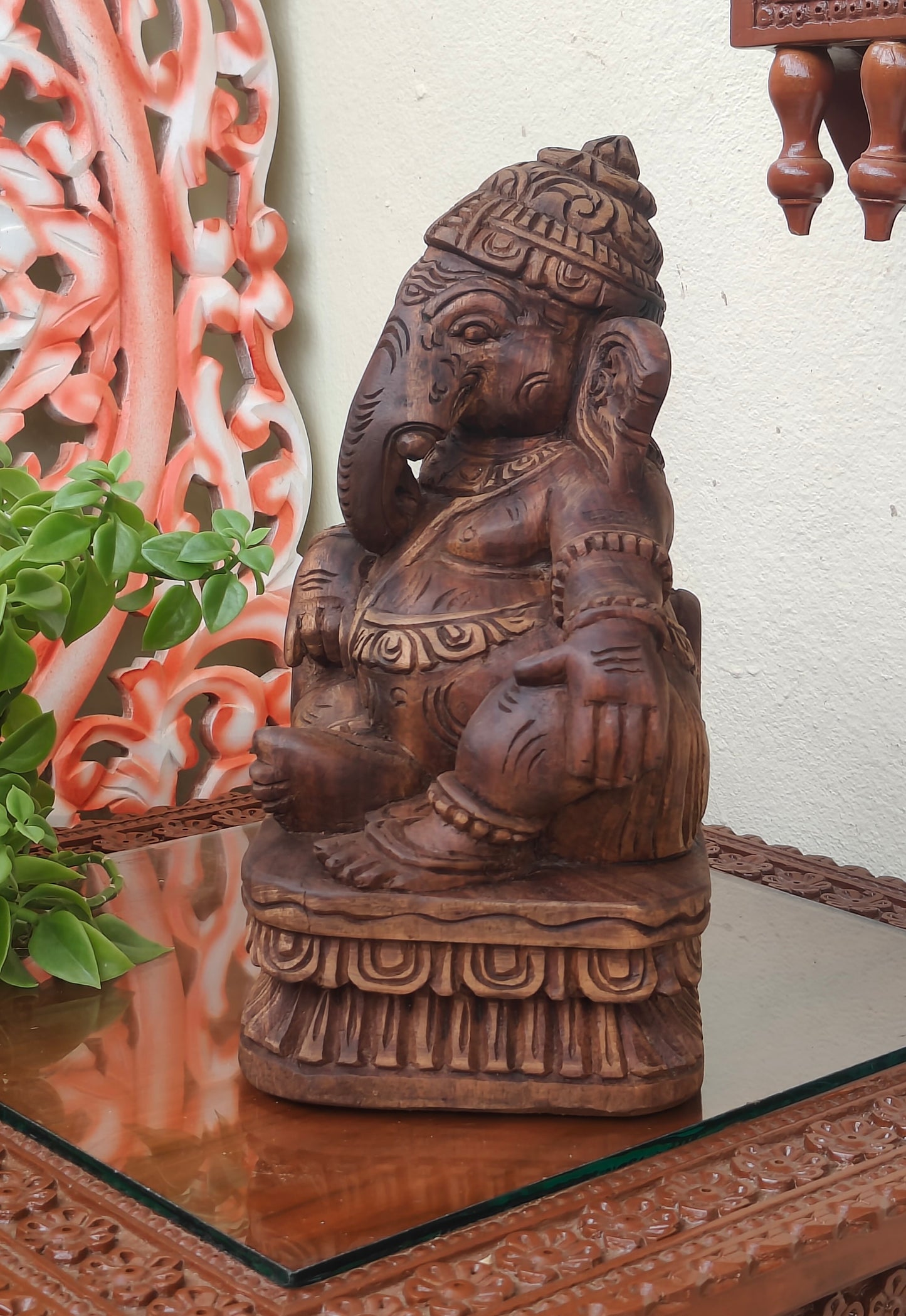 Ganesha playing musical instrument.