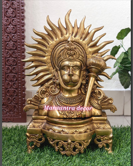 Lord Hanuman face with beautiful peetam and sun in the backdrop.