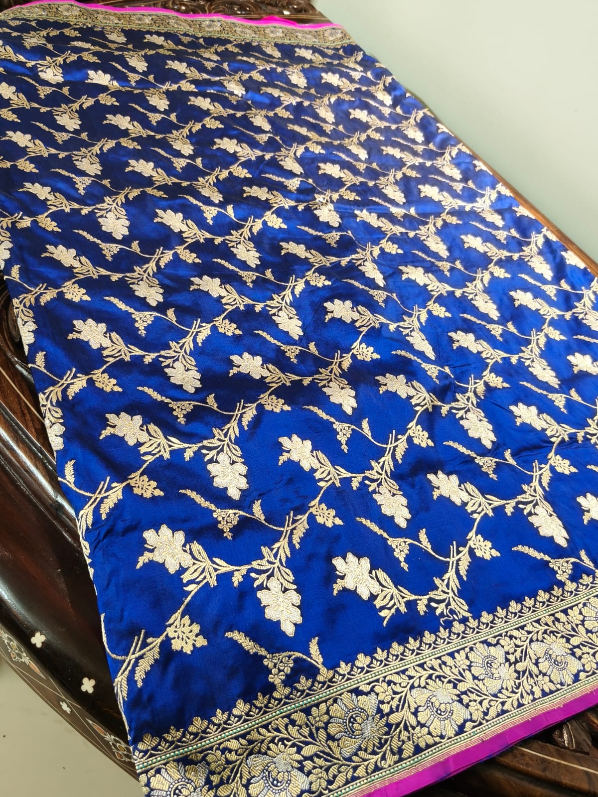 Pure Mulberry silk blue with golden and silver zari work throughout the saree. 100% pure silk with pure zari completely hand weaved