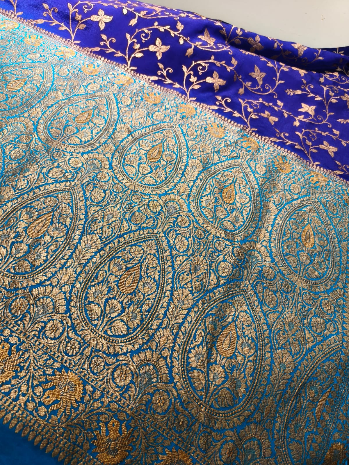 Pure crepe blue silk saree in sheer, and breathable fabric hand woven from 100% mulberry silk. Dual tone colour accentuates the beauty of this masterpiece.