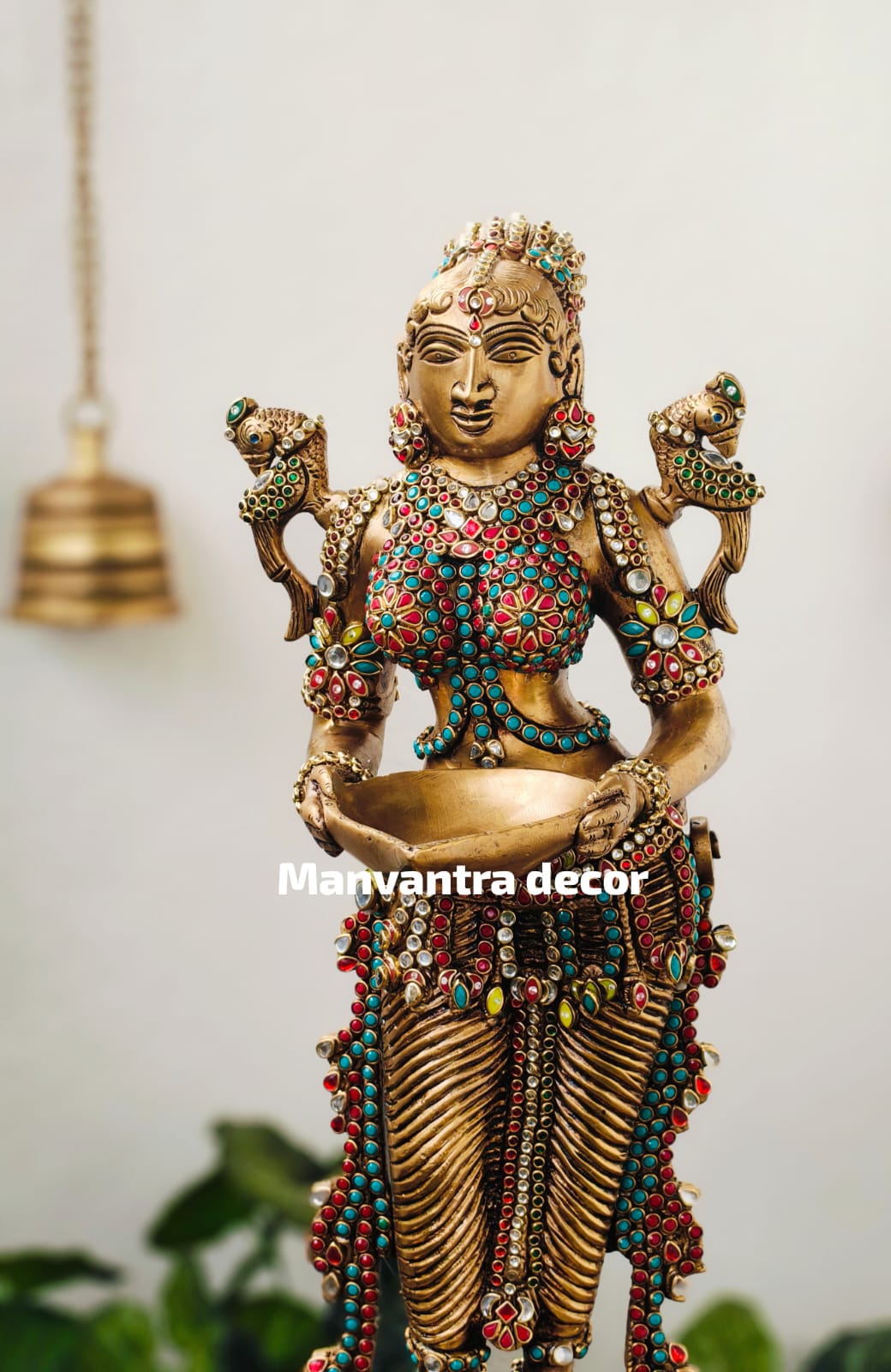 Deeplady in pure brass with stonework