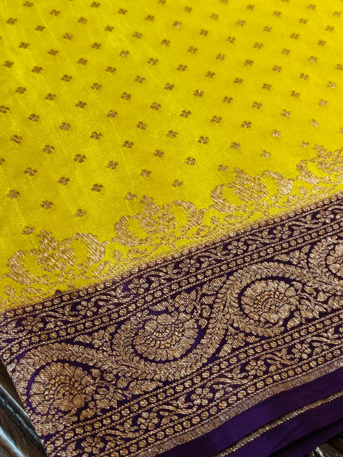 Pure crepe yellow with contrast wine colour silk saree in sheer, and breathable fabric traditionally woven from 100% mulberry silk and pure zari, completely hand weaved