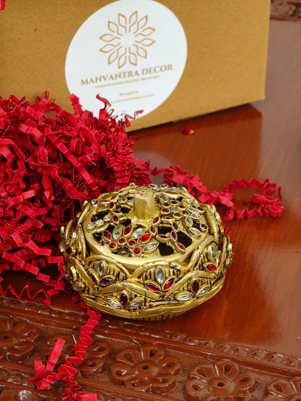 Dhoop/ Kumkum box/ jewellery box.
Studded with shimmering stonework.