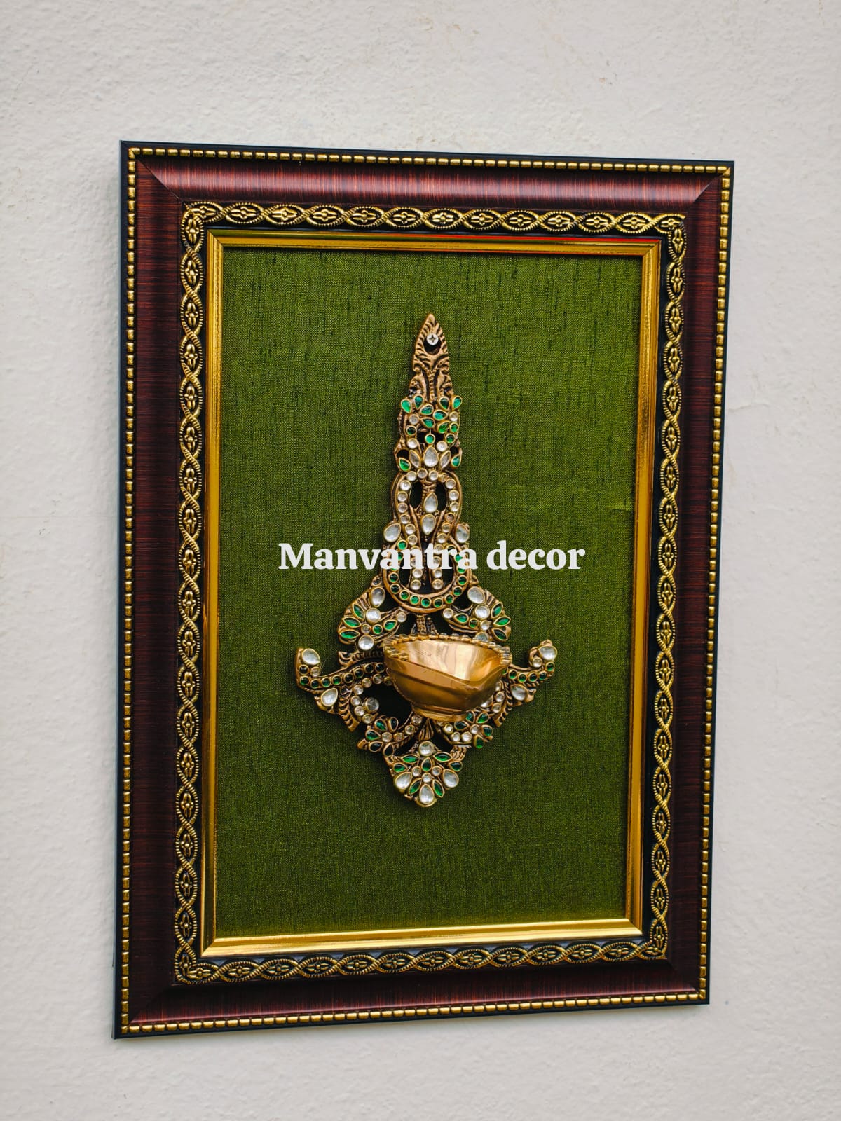 Wall frame with brass deepak  in brass (stonework)