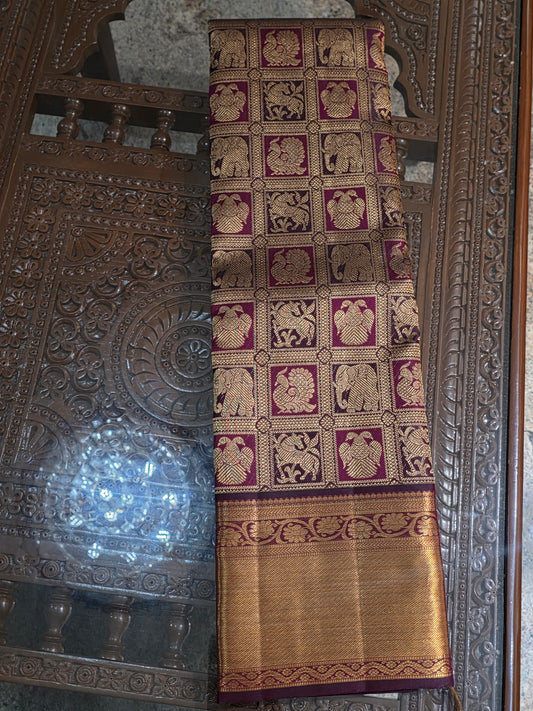 Pure Mulberry brown and maroon dual tone colour silk saree with pure zari completely hand woven.