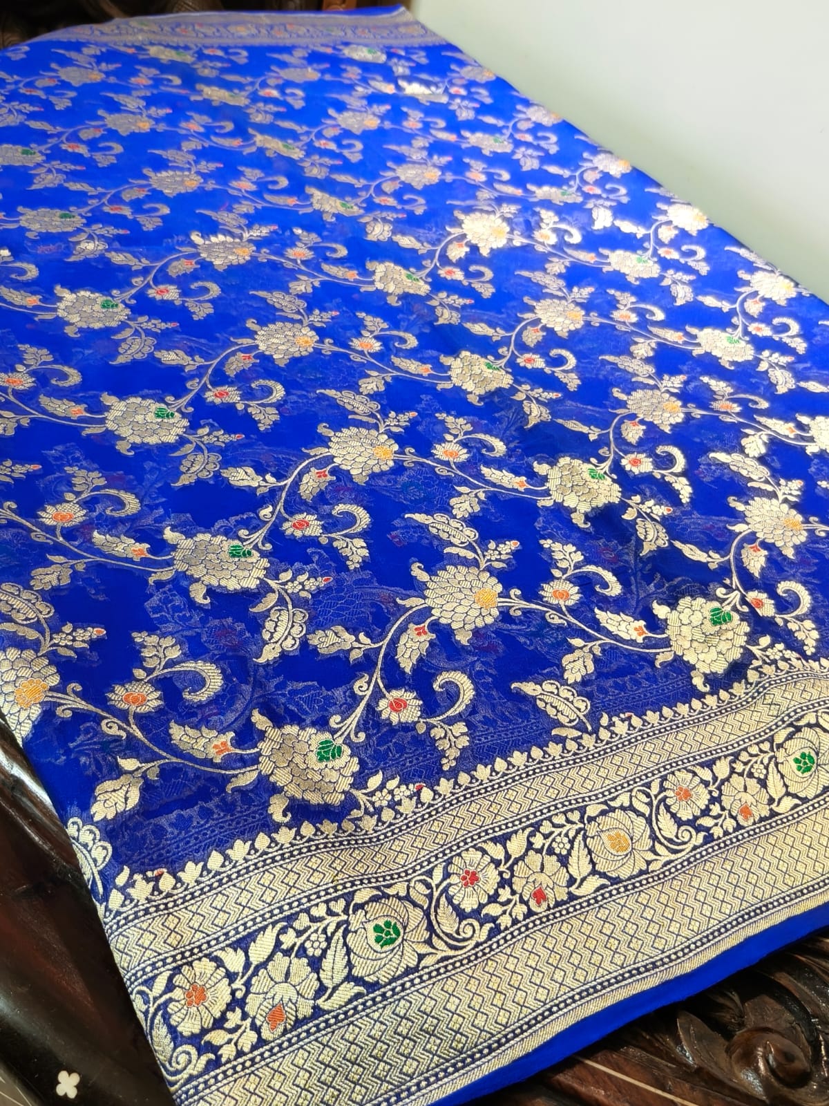 Pure silk blue with meena work is sheer and breathable silk hand woven with pure zari