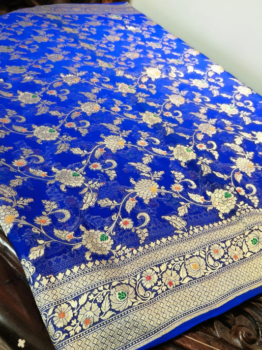 Pure silk blue with meena work is sheer and breathable silk hand woven with pure zari