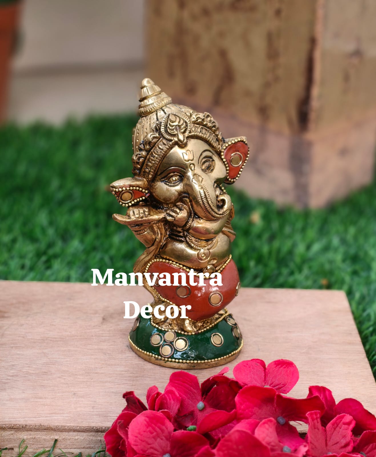 Cute baby Ganesha in pure brass with unique stonework done completely by hand