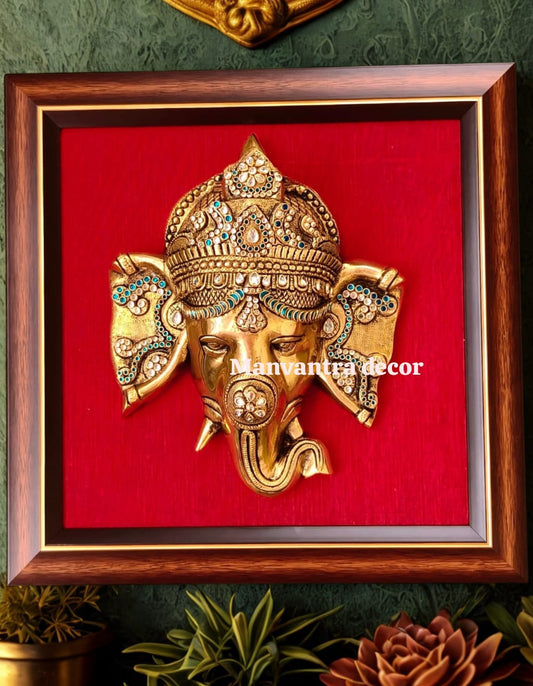Ganesha wall hang with stonework on frame with silk cloth