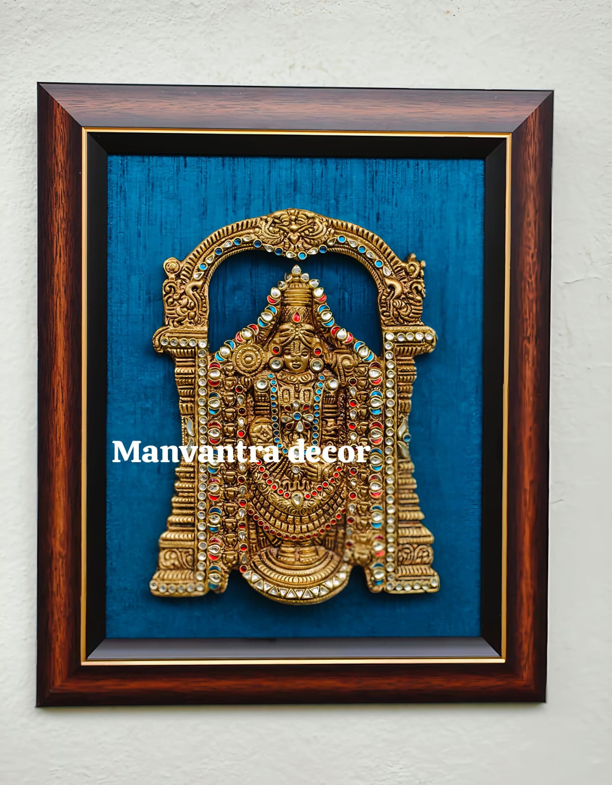 Wall frame with Brass Balaji wall hang with stonework.