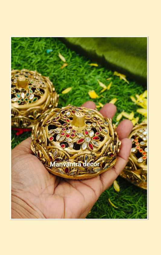 Dhoop/ Kumkum box/ jewellery box.
Studded with shimmering stonework.
