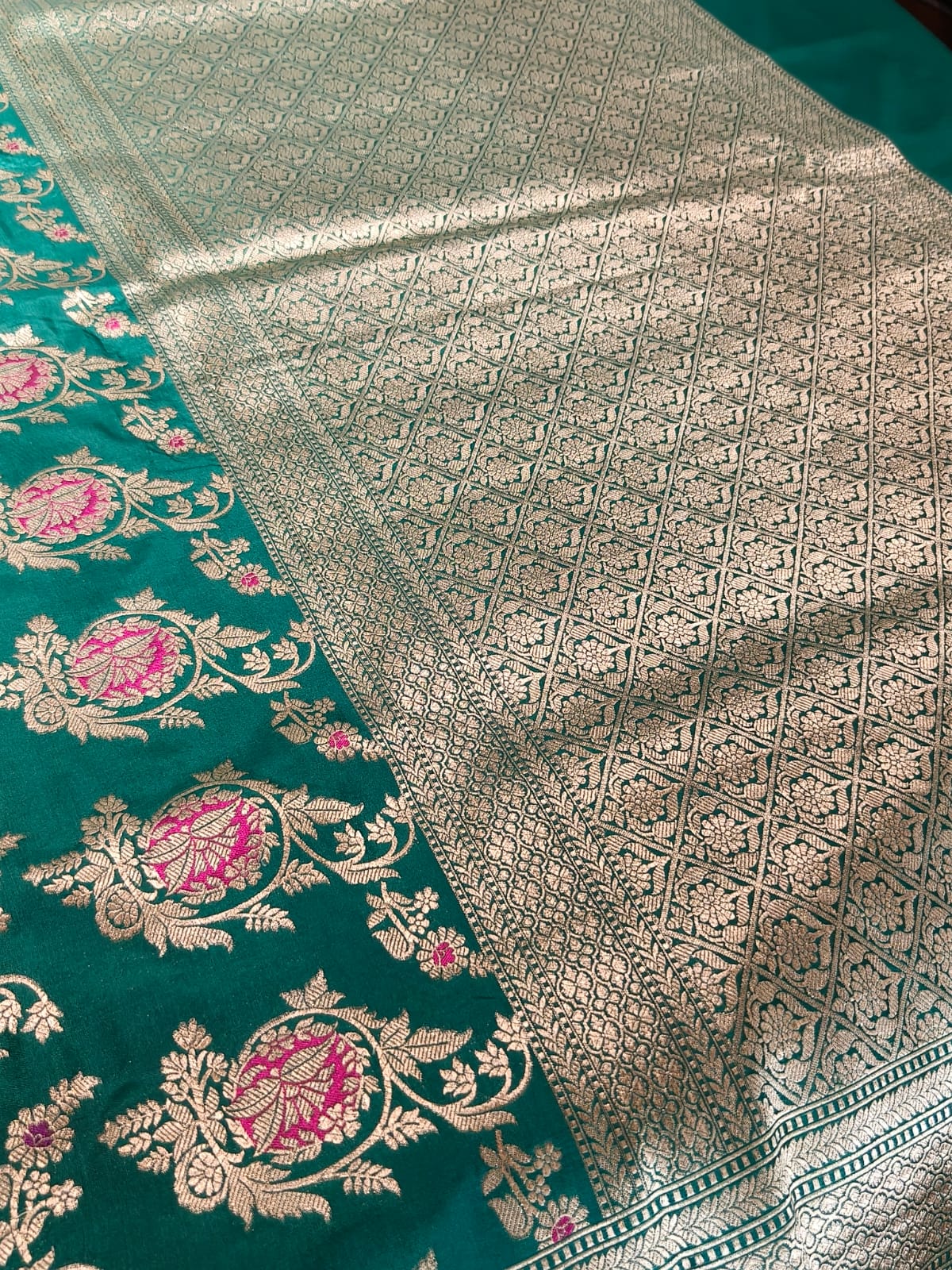 Pure Mulberry silk green with golden and silver zari work throughout the saree. 100% pure silk with pure zari completely hand woven