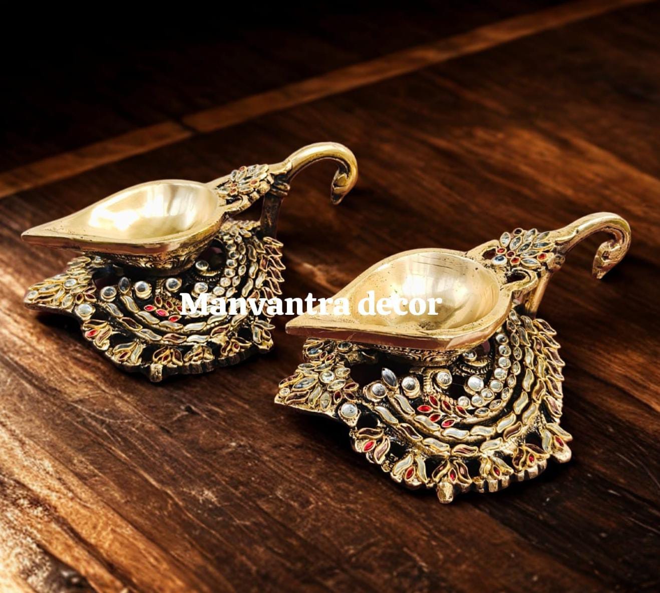 Beautiful shimmering deepams in brass studded with special stone work by hand (pair)