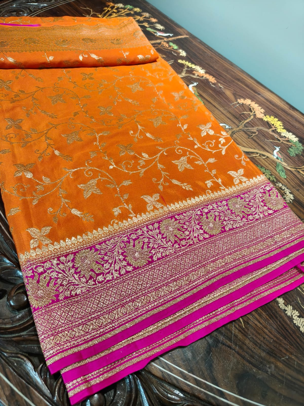 Pure crepe orange silk saree in sheer and breathable silk completely hand woven with pure zari