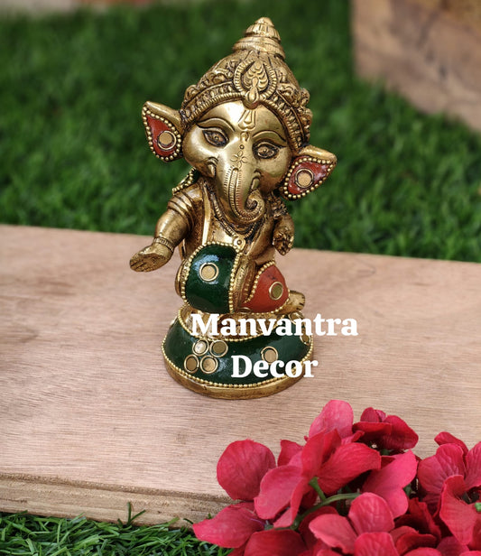 Cute baby Ganesha in pure brass with unique stonework done completely by hand