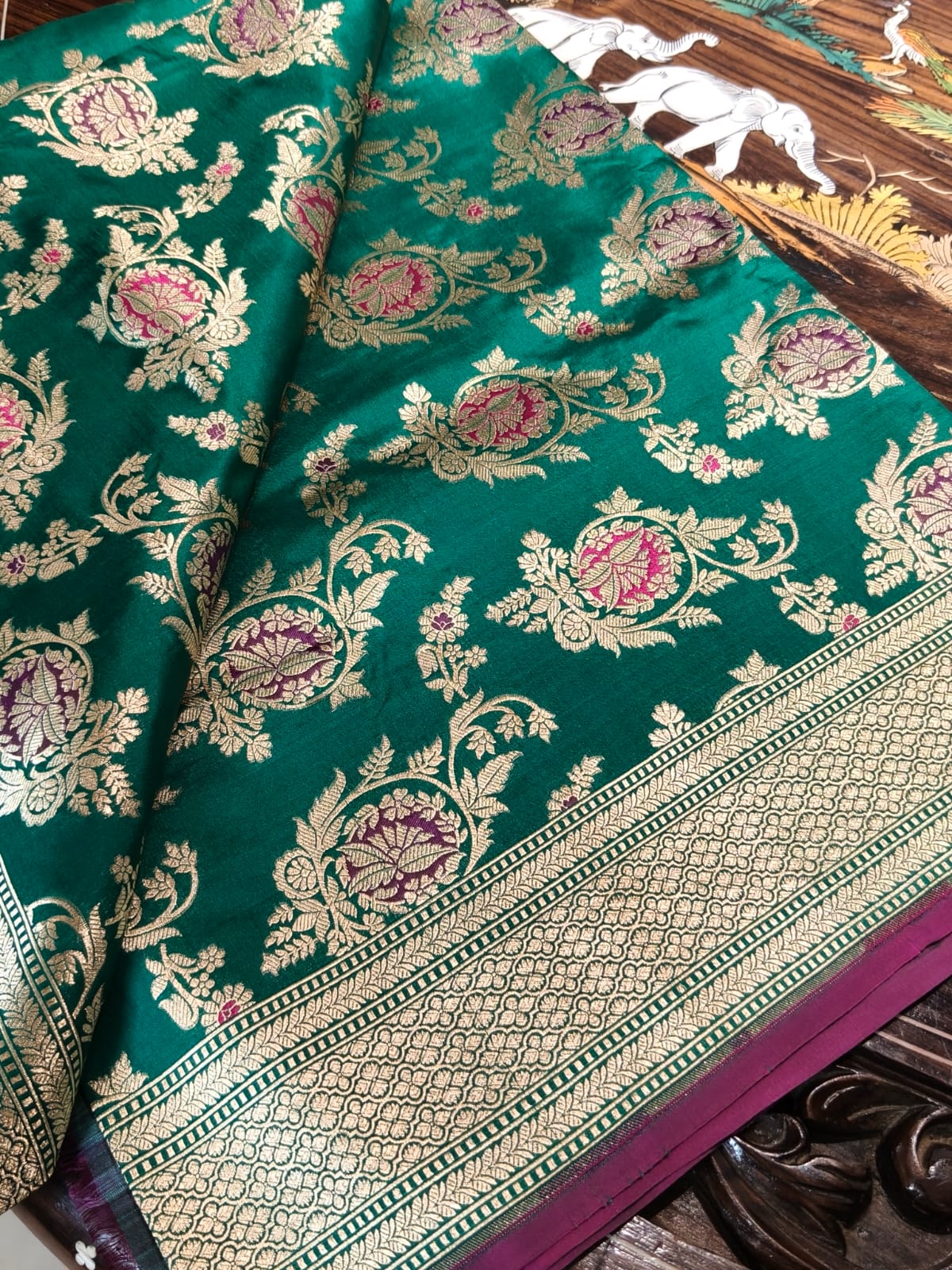 Pure Mulberry silk green with golden and silver zari work throughout the saree. 100% pure silk with pure zari completely hand woven