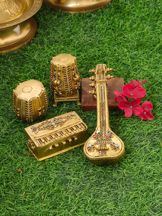 Musical instruments in pure brass studded with kundan stones , completely handcarved