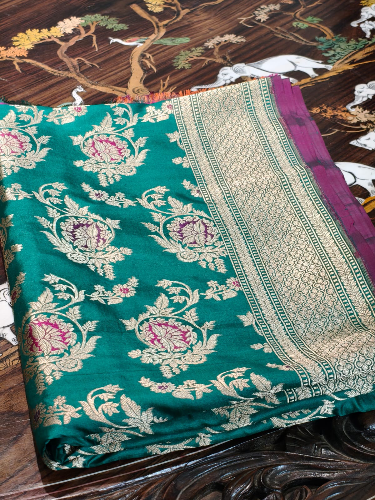 Pure Mulberry silk green with golden and silver zari work throughout the saree. 100% pure silk with pure zari completely hand woven