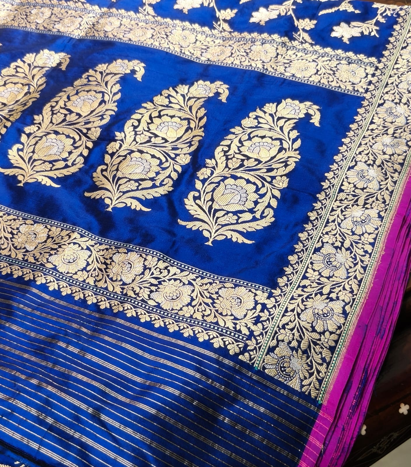 Pure Mulberry silk blue with golden and silver zari work throughout the saree. 100% pure silk with pure zari completely hand weaved