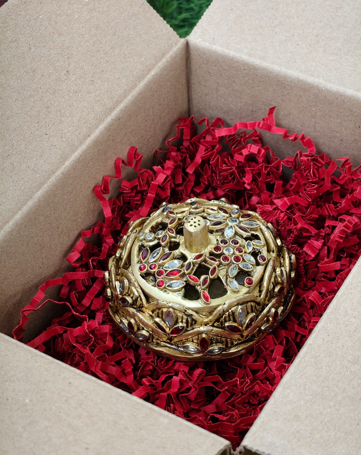 Dhoop/ Kumkum box/ jewellery box.
Studded with shimmering stonework.