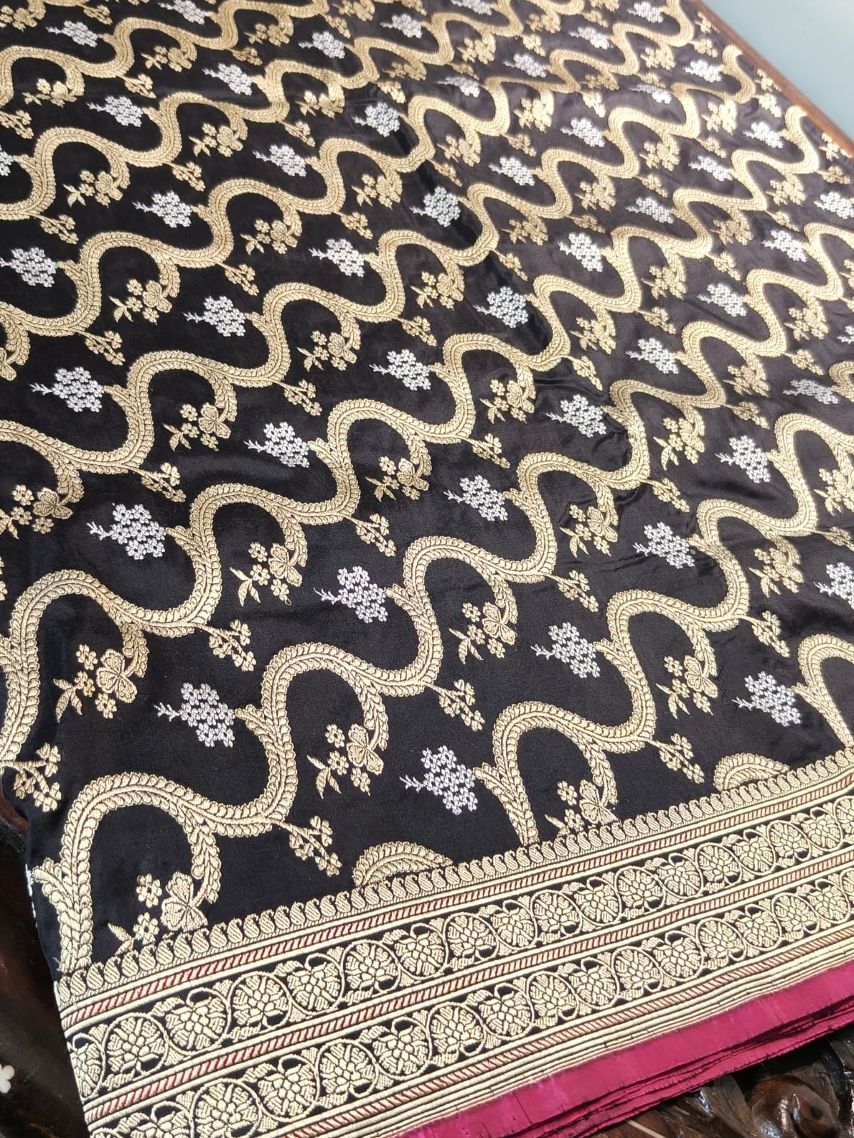 Pure Mulberry silk black with golden and silver zari work throughout the saree. 100% pure silk with pure zari completely hand weaved