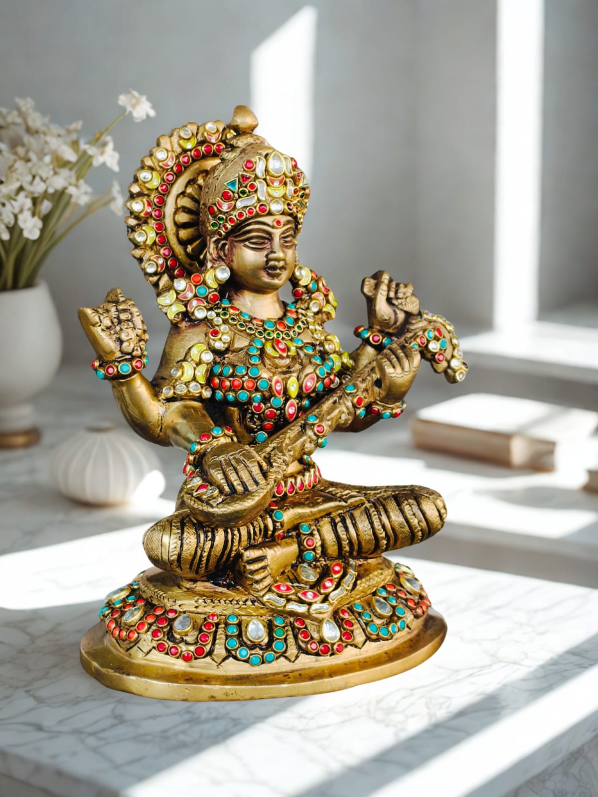 Godess saraswati idol in brass with special stonework done by hand