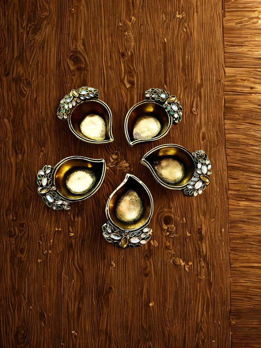 Leaf design diyas in pure casted brass ( pair )